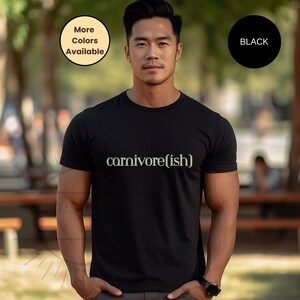 May include: A black t-shirt with the text "carnivore(ish)" printed in a light yellow color.