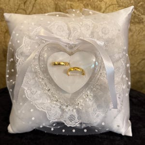 Ringbearer pillow beautiful white satin accented with white polka dotted lace  Heart shaped clear box  with pearl and rhinestone flowers