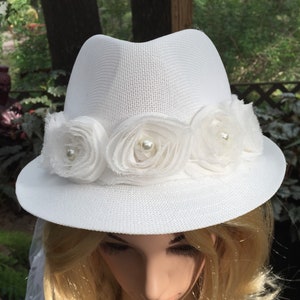 Wedding white bridal fedora hatband of shabby chic flowers with pearl centers. the 36&quot; veil accented with small ribbon bows. One-of-a-kind
