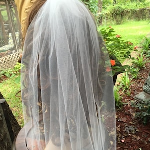 Wedding bridal veil on an alligator clip trimmed with lace and pearls