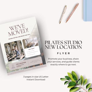May include: A Pilates studio flyer with the text "WE'VE MOVED!" and "PILATES STUDIO NEW LOCATION". The flyer includes images of the studio and text about the new location and services. Two pens and a notebook are also visible.