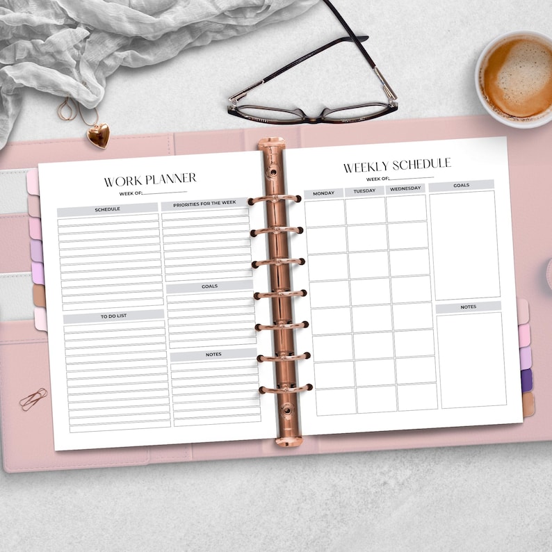 An open work planner displaying a weekly schedule and sections for goals, to-do list, and notes. Surrounding items include glasses, a heart-shaped charm, and a cup of coffee on a light background.