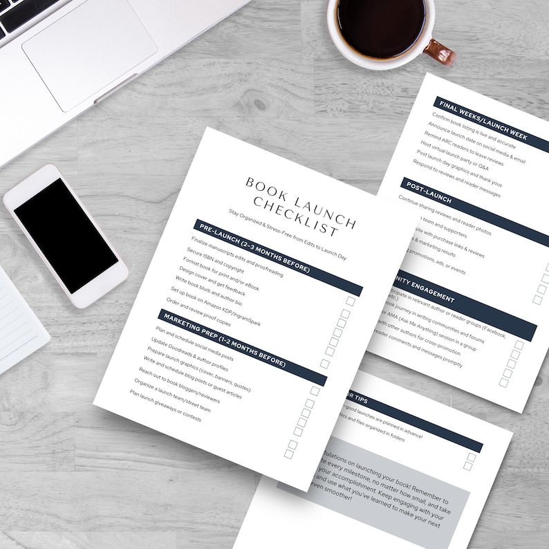 A flat lay of a book launch checklist on a wooden table, featuring sections for pre-launch, marketing, post-launch, and tips, alongside a laptop and a smartphone.
