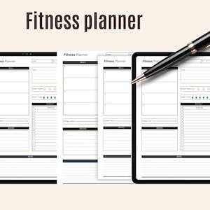May include: A fitness planner with a black pen resting on top. The planner has a black border and a white interior with sections for goals, meals, mood, water intake, and exercise. The text "Fitness planner" is at the top.