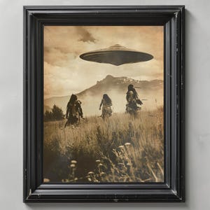 May include: Sepia-toned framed print depicting three figures in a field, with a UFO hovering above. The black frame surrounds the image, which features a mountain range in the background and tall grass in the foreground. The artwork evokes a sense of mystery and the unknown.