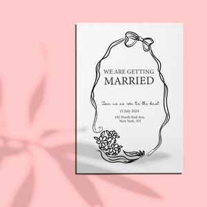 wearth with bow and floral wedding invitation