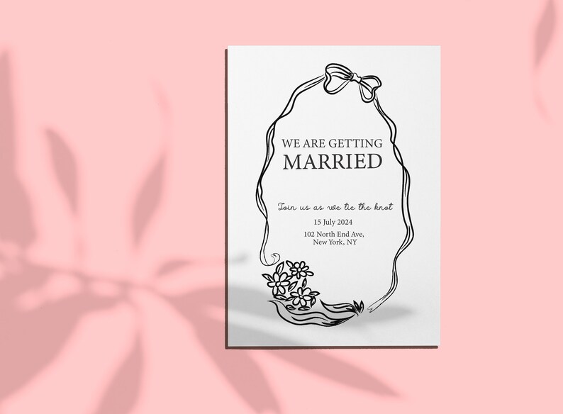 wearth with bow and floral wedding invitation