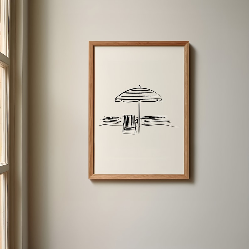 May include: A black and white line drawing of a beach umbrella and a chair on a beach.