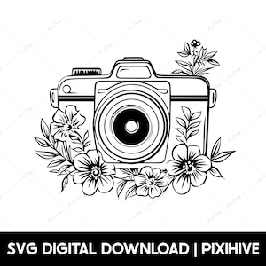 May include: Black and white line art illustration of a camera with a lens and a floral design around it.