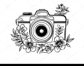 May include: Black and white line art illustration of a camera with a lens and a floral design around it.