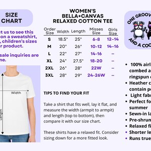 May include: White t-shirt with a size chart and text. The chart lists measurements in inches for women's relaxed cotton tees, including width and length. The image also features a cartoon dog and cat.