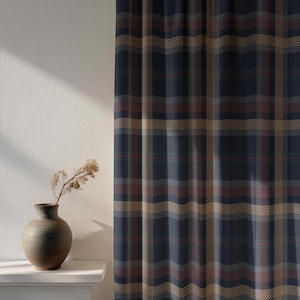 May include: A navy blue plaid curtain with brown, green, and red accents. The curtain is hanging in front of a white wall. A brown vase with dried flowers sits on a white shelf.