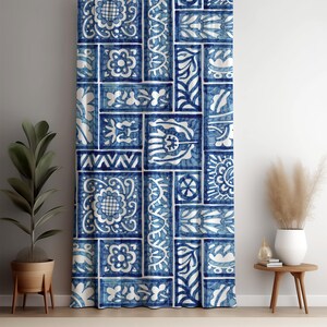 May include: Blue and white patterned curtain with a repeating tile design. The curtain features a variety of floral and geometric motifs in shades of blue and white. The design is arranged in a patchwork style, creating a visually interesting pattern.