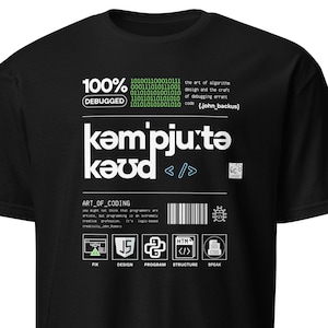 May include: Black t-shirt with a white graphic design featuring the text "kəmpjutə kǝud < />" and the words "ART_OF_CODING". The graphic also includes icons for HTML, Javascript, Python, and a computer monitor.
