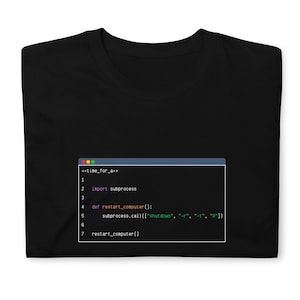 May include: A black t-shirt featuring a white code snippet. The code snippet is a Python function called "restart_computer" that uses the "subprocess" module to shut down and restart a computer.