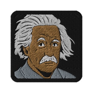 May include: Embroidered patch featuring a portrait of Albert Einstein with white hair, brown skin, and a grey suit. The patch is set against a black background.