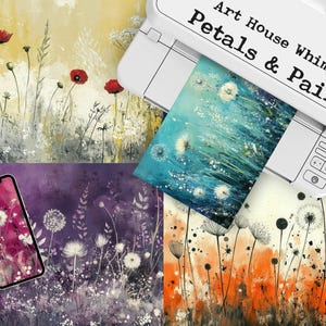 May include: A white printer with the text "Art House Whimsy Petals & Paint" printed on the top. The printer is printing a design of white dandelions on a blue background. There are three other designs of dandelions on different backgrounds, including a purple background, a white background, and an orange background.