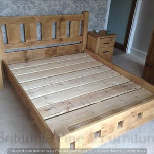 May include: A wooden bed frame with a slatted headboard and footboard. The frame is made of reclaimed wood and has a natural finish.