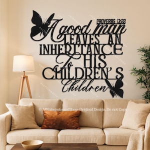 May include: Black metal wall art with the quote "A good man leaves an inheritance to his children's children" and two butterfly silhouettes. The text includes "Proverbs 13:22". The art is displayed above a beige sofa.