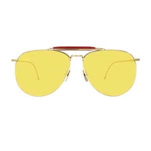 May include: Aviator-style sunglasses with a gold-colored frame and bright yellow lenses. The sunglasses feature a red bridge detail. The lenses are a vibrant yellow color, offering a bold and stylish look.