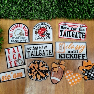 May include: A collection of embroidered patches with football and tailgate themes. Designs include a football helmet, a cooler, a pom-pom, a football, a heart, and a cowboy hat. Text includes phrases like "Tailgate Harder", "Touchdown Season", and "Here for the Tailgate".
