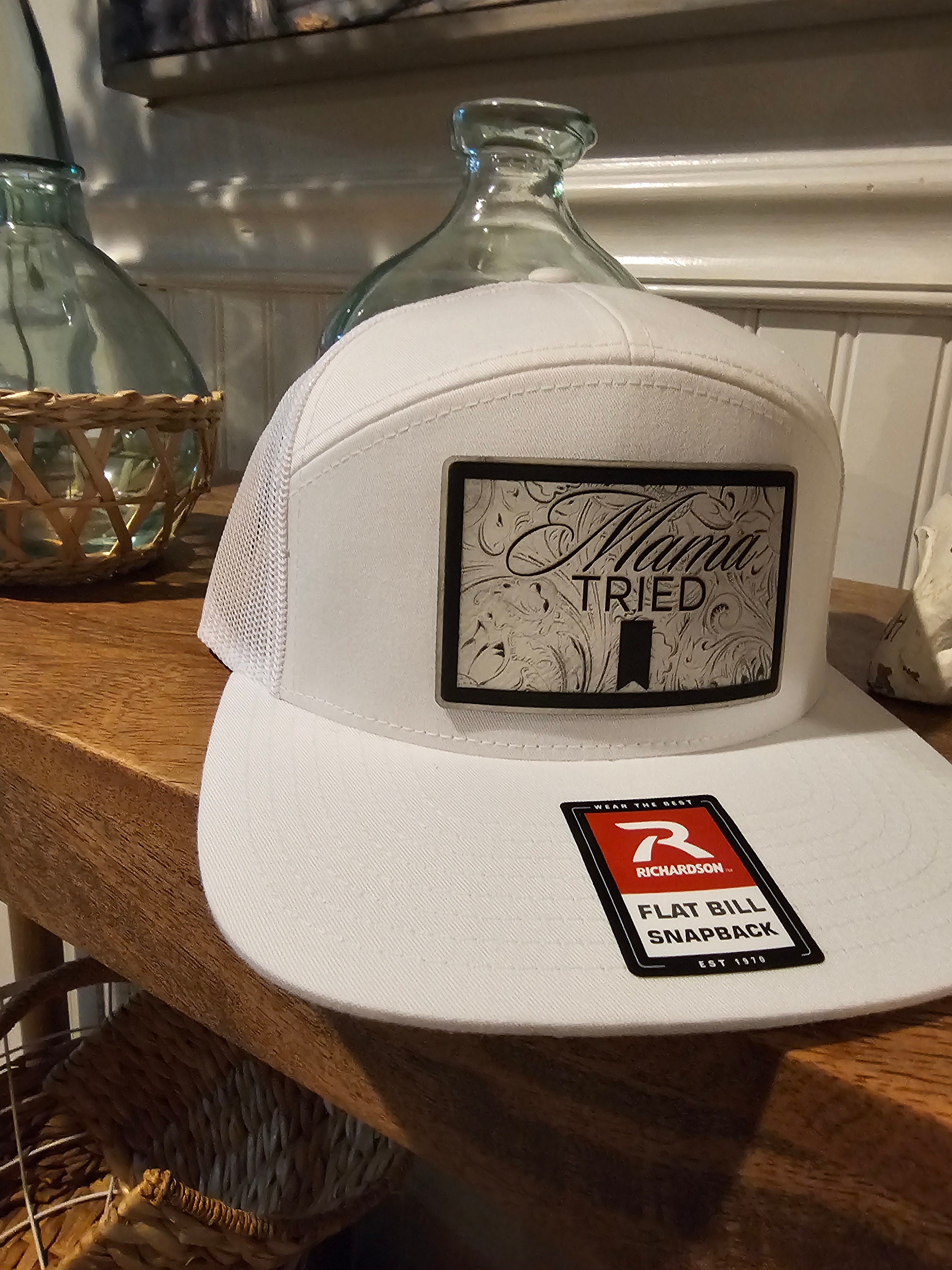 Mama Tried Mama Tried all white leather on a white Richardson 112 trucker round bill or 168 flat bill hat