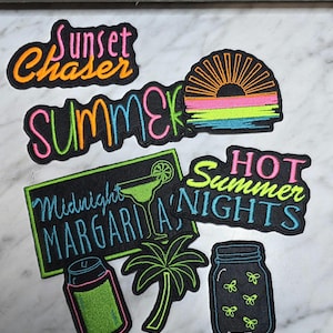 May include: A collection of embroidered patches with summer-themed designs. The patches feature phrases like "Sunset Chaser," "Summer," and "Hot Summer Nights." Other designs include a margarita, a palm tree, a can, a sunset, and a jar of fireflies. The patches have neon color accents.