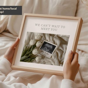 May include: A framed print with the text "WE CAN'T WAIT TO MEET YOU" above a sonogram image and a bouquet of white tulips. The print also includes the text "Baby Preller, April 2024".