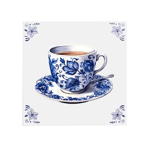 May include: A blue and white teacup and saucer with a floral design. The teacup is filled with brown liquid.