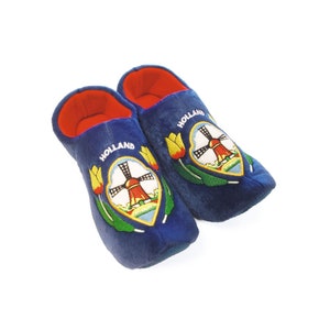 May include: Pair of blue slipper shoes with embroidered Dutch windmill and tulip designs. The slippers have red lining and say "Holland" on the side.