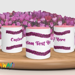 May include: Three white ceramic mugs with pink rims. Each mug features a design of pink flower buds in a wavy pattern. The mugs have customizable text, including "Custom", "Custom Text Here", and "Text Here".