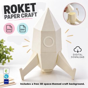 Può includere: Un razzo di carta color crema dal design geometrico, dotato di un oblò circolare e tre pinne. L'immagine include il testo ROKET PAPER CRAFT, SVG, DXF, DIGITAL DOWNLOAD e include uno sfondo per lavoretti a tema spaziale 3D gratuito.