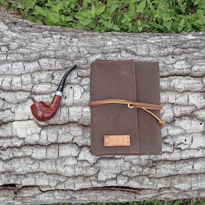 May include: A set of three ceramic nesting bowls in shades of blue, green, and white. The bowls feature a speckled glaze and a simple, modern design. The largest bowl measures approximately 6 inches in diameter.