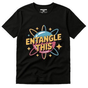 May include: Black t-shirt featuring a colorful graphic design. The design includes a blue and pink planet with yellow and blue orbiting lines and the text "ENTANGLE THIS" in yellow. The shirt is made of a soft material.