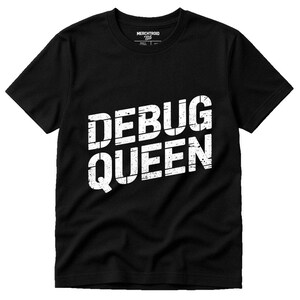 May include: Black t-shirt with the white text "DEBUG QUEEN" in a bold, distressed font. The shirt has a crew neck and short sleeves. The brand name "MERCHTROID" is printed on the upper back of the shirt.
