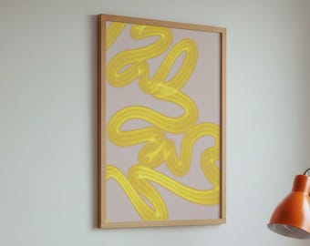 May include: A framed abstract art print with yellow brushstrokes on a light pink background hangs on a wall. A wooden cabinet holds a turntable, a black stereo receiver, and an orange desk lamp. The room has a minimalist aesthetic.