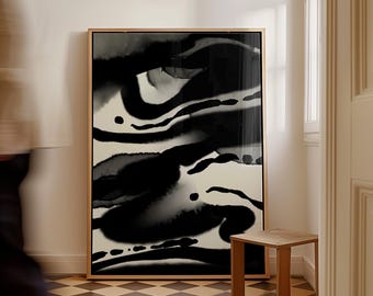 May include: Abstract black and white artwork in a gold frame. The painting features flowing, organic shapes and ink-like textures. The artwork is displayed in a room with a checkered floor and a small wooden stool.