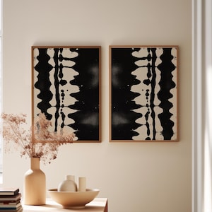 Set of 2 black and white abstract ink drawings inspired by zebra patterns. These modern monochrome paintings feature fluid brushstrokes, creating a minimalist and sophisticated gallery wall. Perfect for Japandi, Scandi, or contemporary home decor, this artistic duo brings elegance and contrast to any living room, bedroom, or office.
