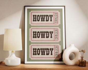 May include: A framed print featuring three vintage-style tickets with the word "HOWDY" in bold, dark letters. Each ticket has a unique number. The background is a muted green.