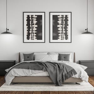 Set of 2 black and white abstract ink drawings inspired by zebra patterns. These modern monochrome paintings feature fluid brushstrokes, creating a minimalist and sophisticated gallery wall. Perfect for Japandi, Scandi, or contemporary home decor, this artistic duo brings elegance and contrast to any living room, bedroom, or office.