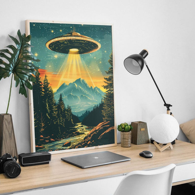 Vintage UFO Wall Art featuring a retro flying saucer illustration with vibrant blue tones, set against a psychedelic alien mountain landscape. This unique and surreal poster brings a cosmic, otherworldly atmosphere to any room, making it the perfect decor piece for sci-fi enthusiasts or those looking for bold, eclectic design. Whether displayed in a living room, bedroom, or office, this striking print adds personality and a conversation-starting element to your home decor.