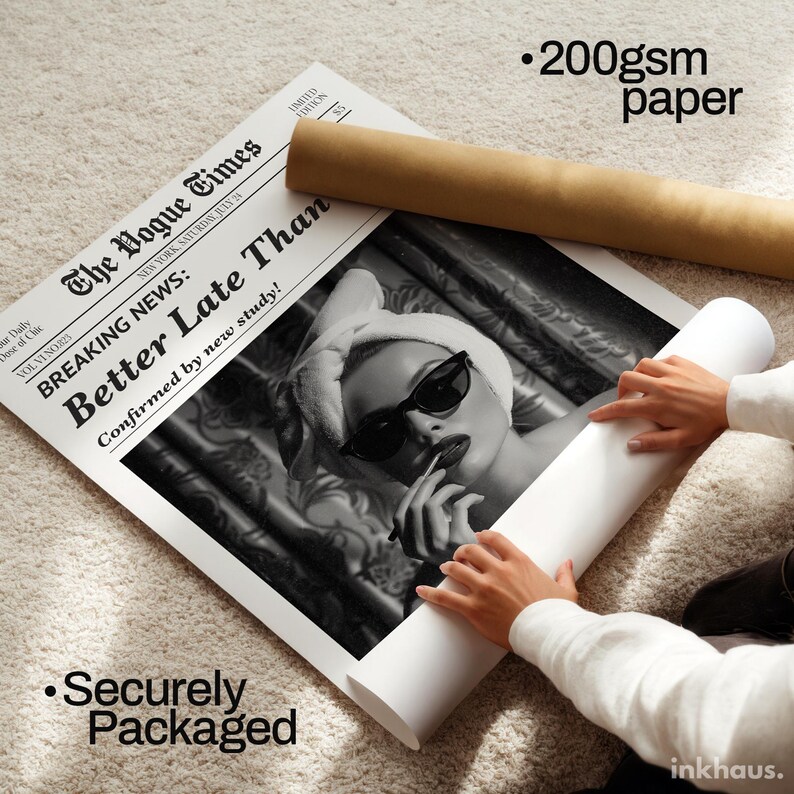 May include: A large poster print on 200gsm paper featuring a black and white image of a person wearing a towel on their head and sunglasses. The print includes the newspaper title The Vogue Times and the headline Breaking News: Better Late Than.