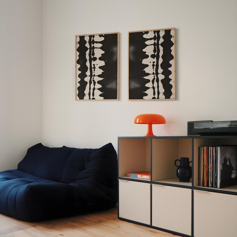 Set of 2 black and white abstract ink drawings inspired by zebra patterns. These modern monochrome paintings feature fluid brushstrokes, creating a minimalist and sophisticated gallery wall. Perfect for Japandi, Scandi, or contemporary home decor, this artistic duo brings elegance and contrast to any living room, bedroom, or office.