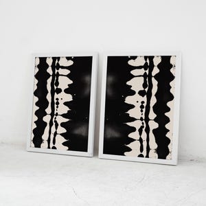 Set of 2 black and white abstract ink drawings inspired by zebra patterns. These modern monochrome paintings feature fluid brushstrokes, creating a minimalist and sophisticated gallery wall. Perfect for Japandi, Scandi, or contemporary home decor, this artistic duo brings elegance and contrast to any living room, bedroom, or office.