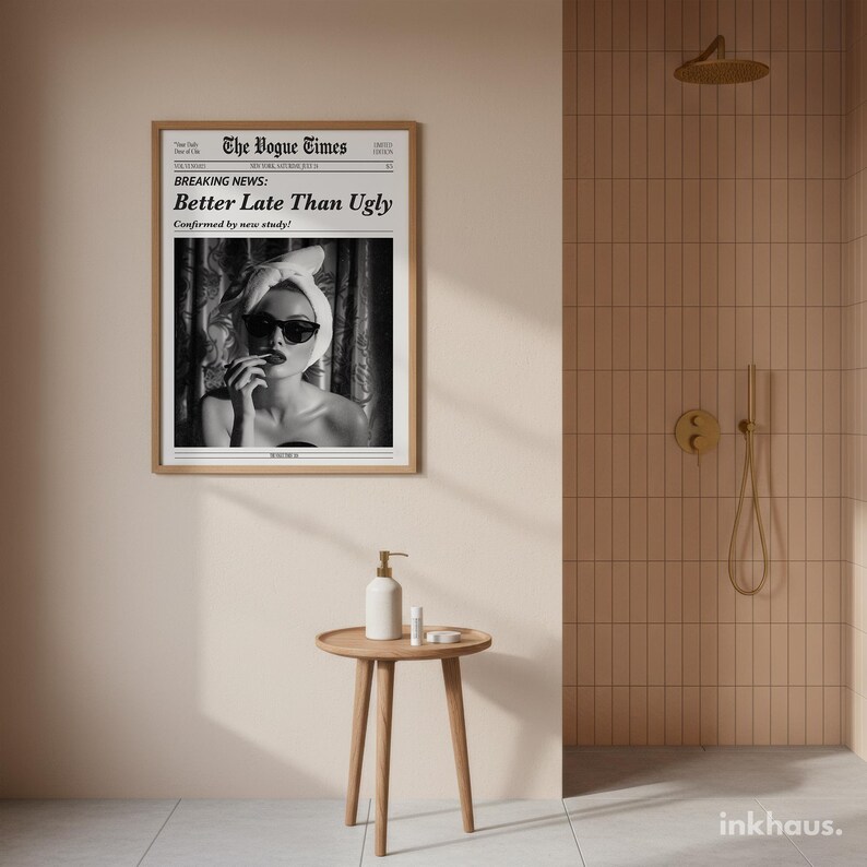 May include: A framed wall art print titled The Vogue Times featuring a black and white photograph of a person wearing a towel on their head and sunglasses, with the text Breaking News: Better Late Than Ugly, Confirmed by new study!