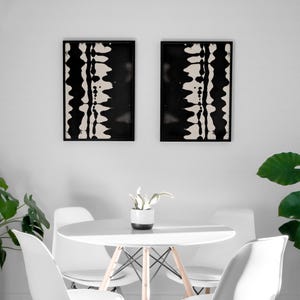 Set of 2 black and white abstract ink drawings inspired by zebra patterns. These modern monochrome paintings feature fluid brushstrokes, creating a minimalist and sophisticated gallery wall. Perfect for Japandi, Scandi, or contemporary home decor, this artistic duo brings elegance and contrast to any living room, bedroom, or office.