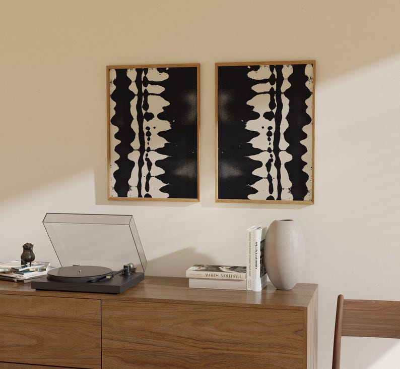 Set of 2 black and white abstract ink drawings inspired by zebra patterns. These modern monochrome paintings feature fluid brushstrokes, creating a minimalist and sophisticated gallery wall. Perfect for Japandi, Scandi, or contemporary home decor, this artistic duo brings elegance and contrast to any living room, bedroom, or office.