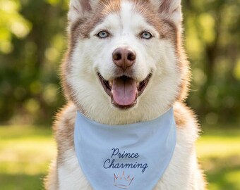 May include: A Siberian Husky dog with brown and white fur and blue eyes, wearing a light blue bandana. The bandana has the text "Prince Charming" and a crown graphic in a handwritten font.