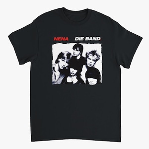 May include: Black t-shirt featuring a black and white image of a band with the text "NENA DIE BAND" in red and white. The band members are in a rectangular frame. The shirt is made of a soft material.