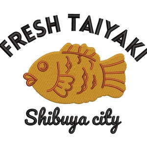 May include: Black and white text reads "Fresh Taiyaki Shibuya City" with a cartoon image of a golden fish-shaped pastry with orange details.